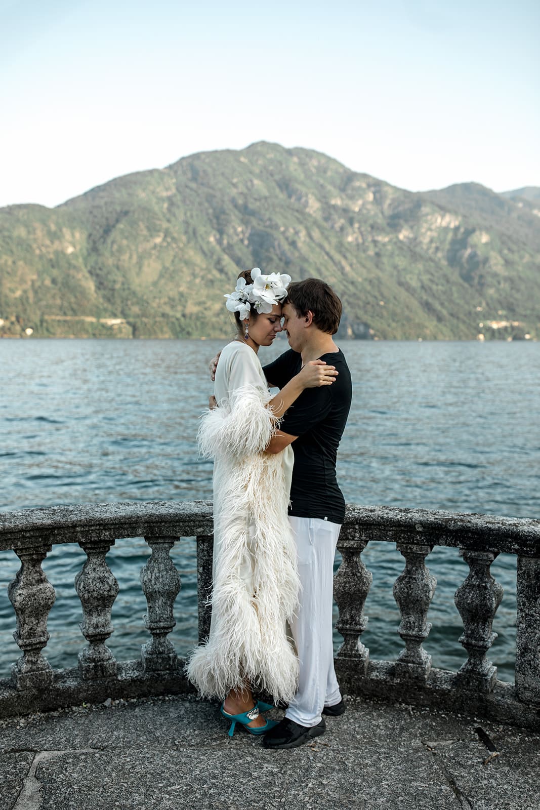 Couple stand on balcony after Lake Como proposal