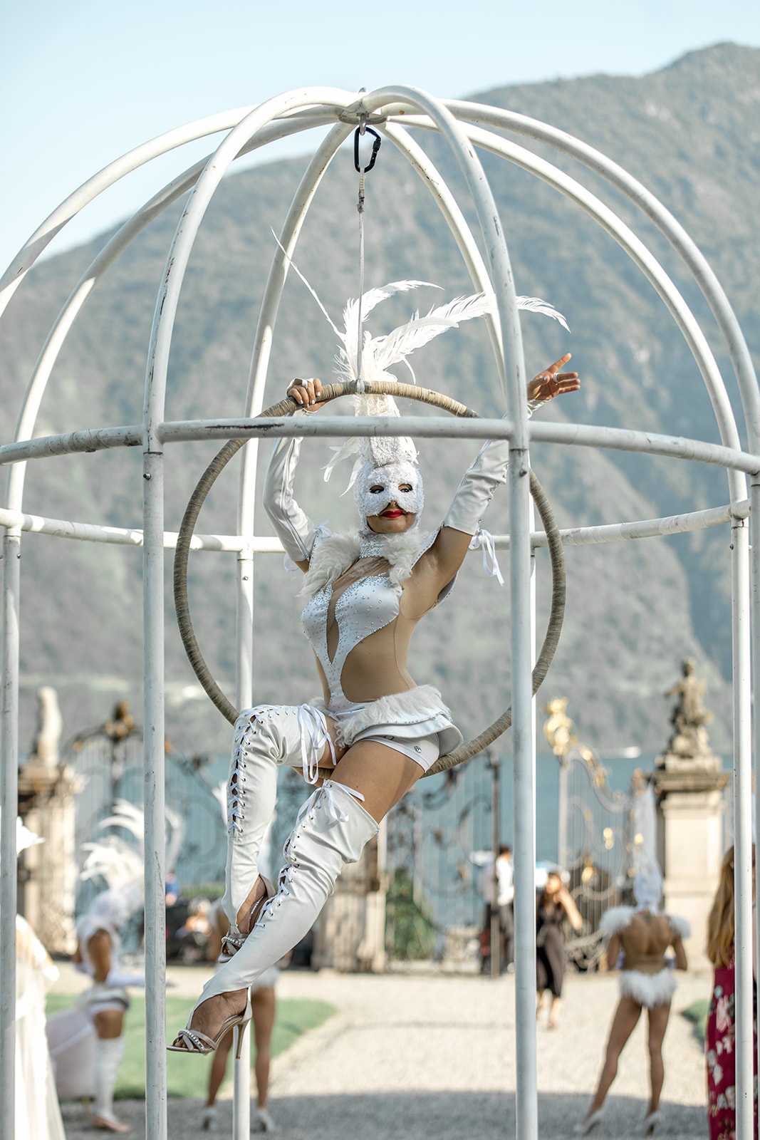 Performer in an iron cage performs for proposal party