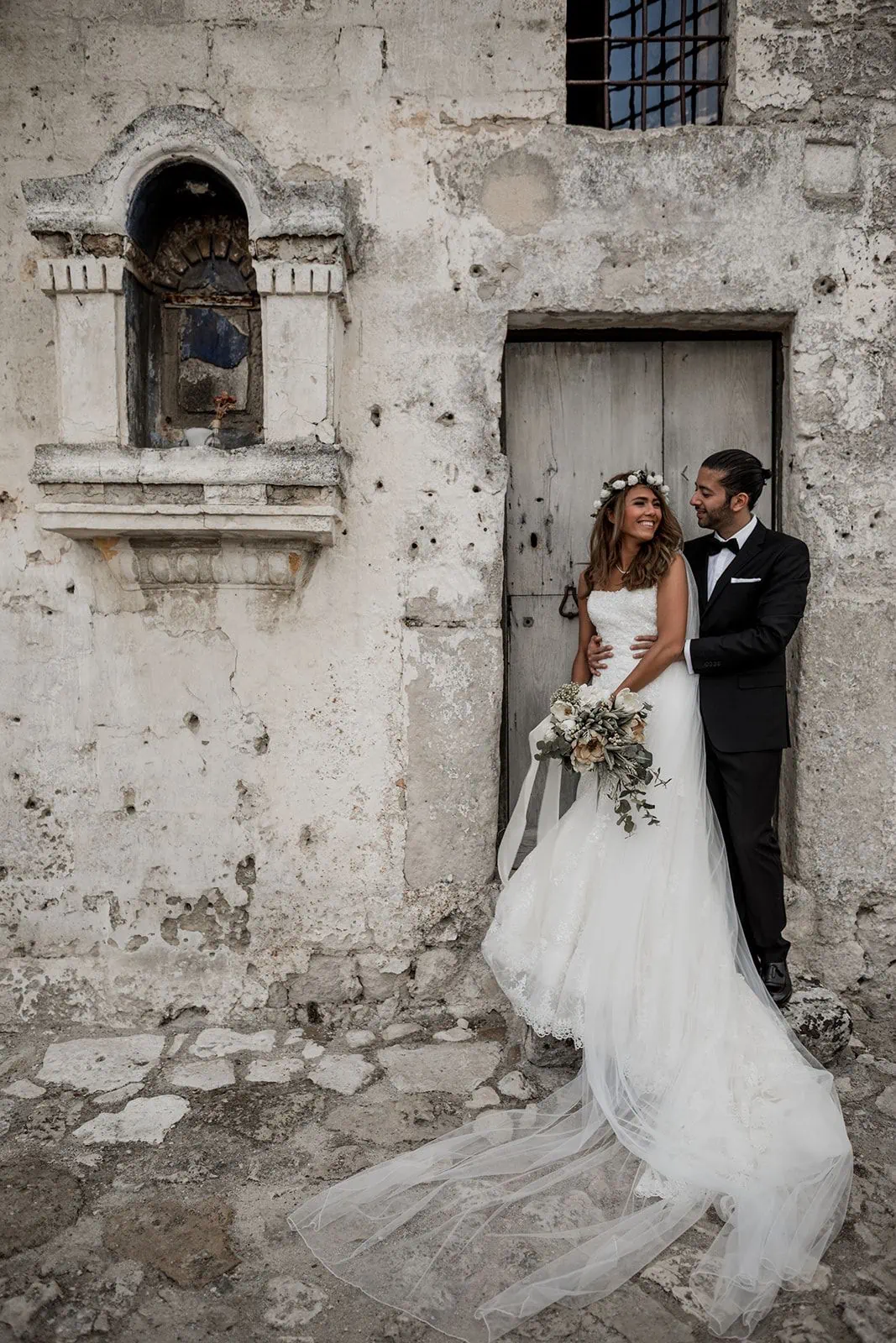 Bride and groom embrace in Matera Italy