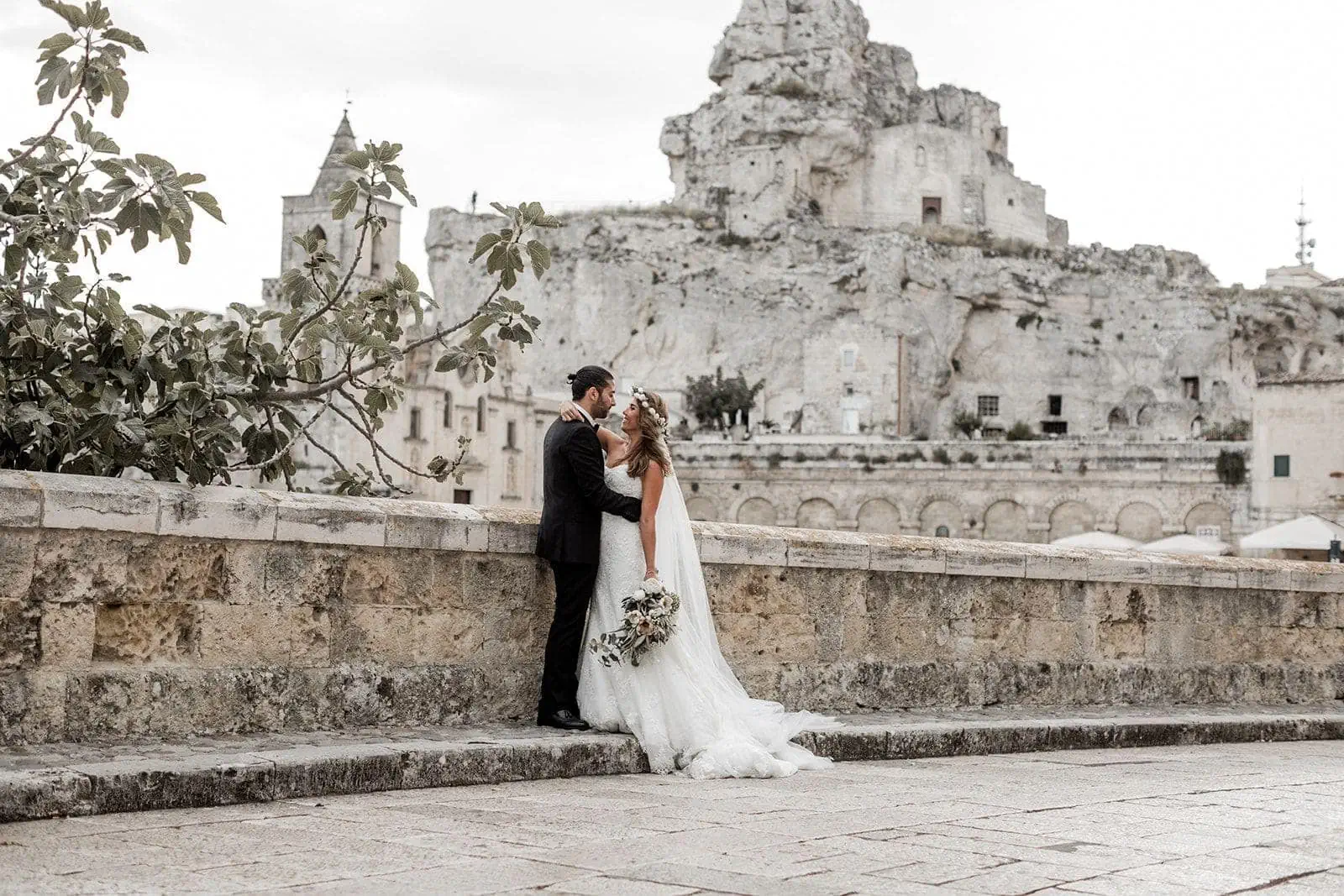 Bride and groom embrace outside in Matera Italy after elopement ceremony