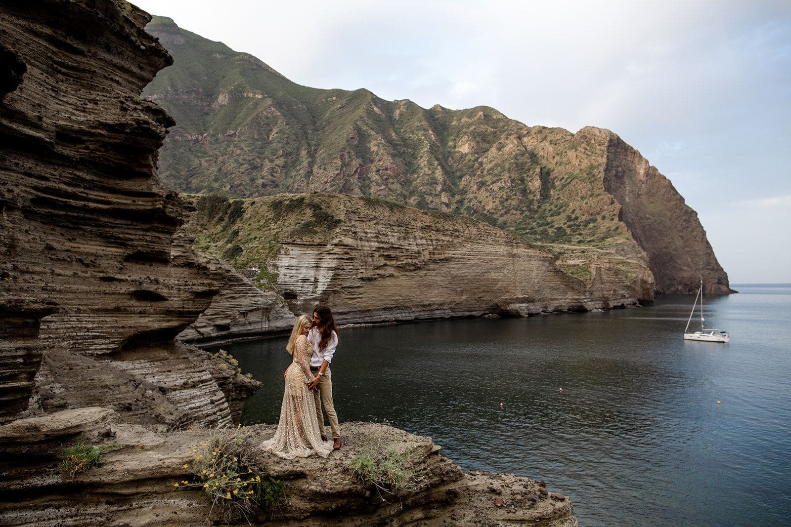 Man and woman stand together in Isole Eolie Salina Sicily elopement