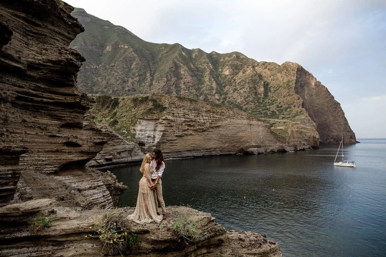 Man and woman stand together in Isole Eolie Salina Sicily elopement