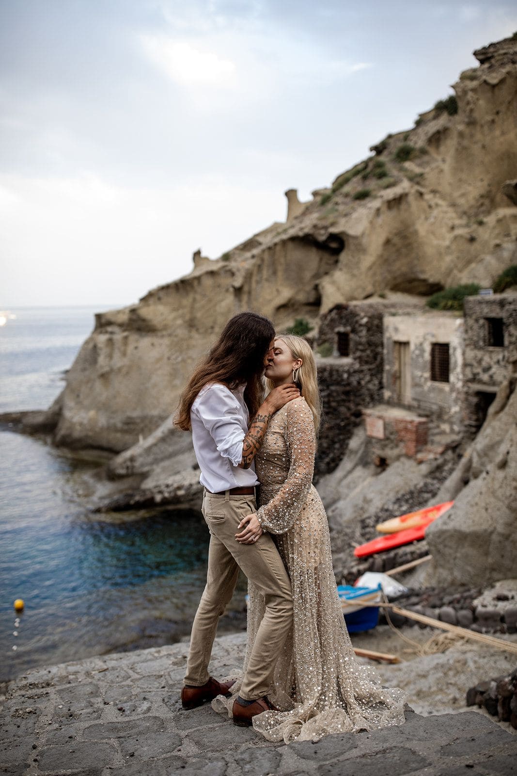 Man and woman kiss in Isole Eolie, Sicily, Italy