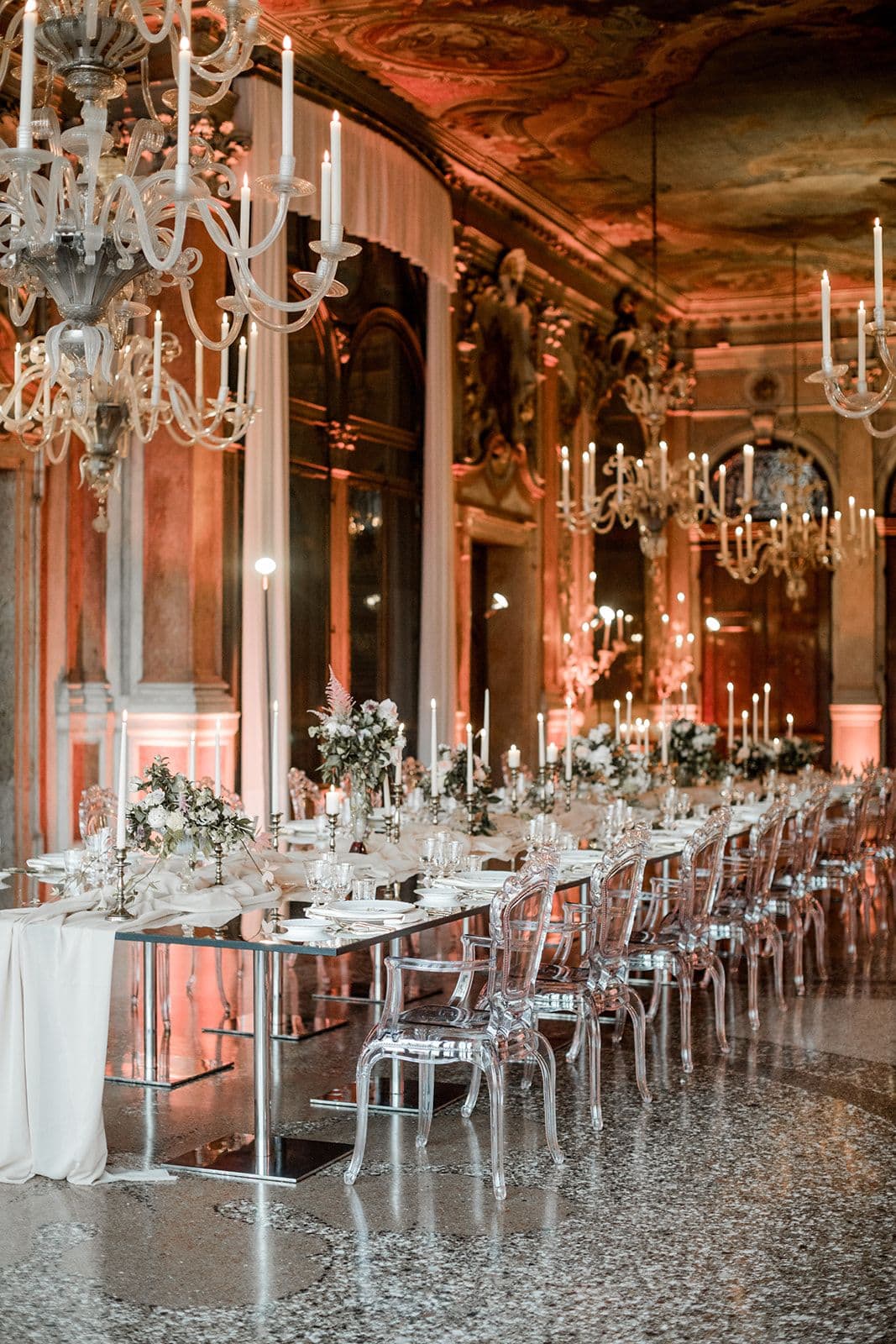 Venice Italy elopement venue reception clear acrylic table and chairs with crystal chandelier