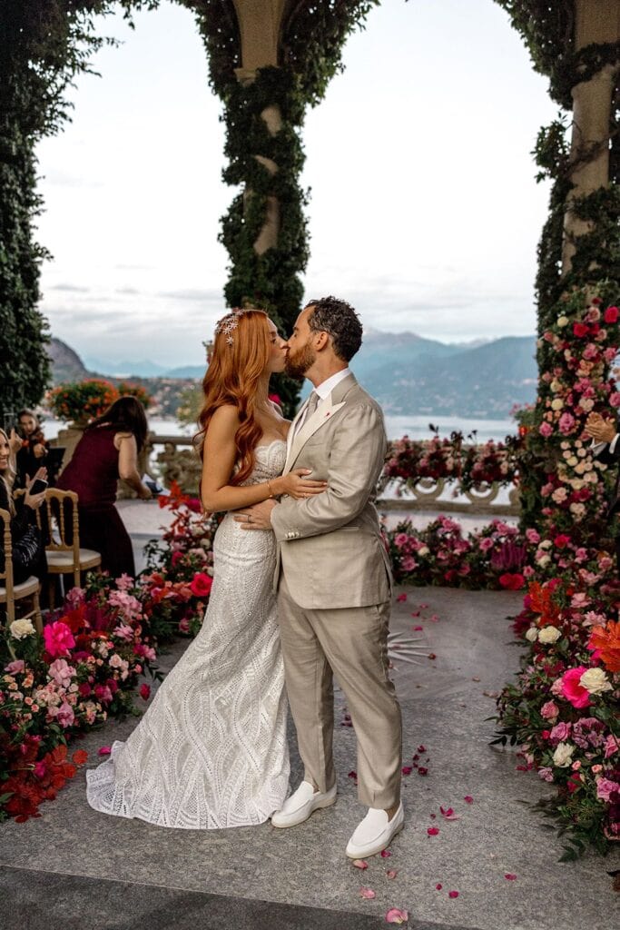 Bride and groom kiss after Villa del Balbianello wedding ceremony