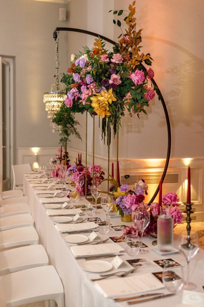 Villa Lario wedding reception chandelier with flower arrangements