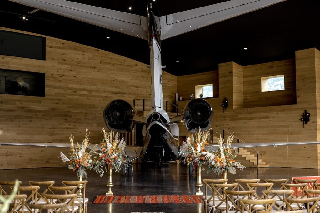 Aviation themed wedding venue in Wyoming complete with a ceremony site inside an airplane hangar