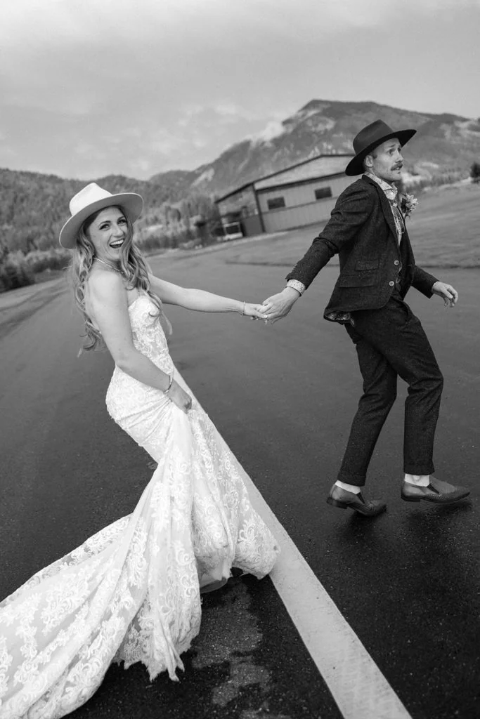 Bride and groom laughing during couple's portraits at their Wyoming destination wedding
