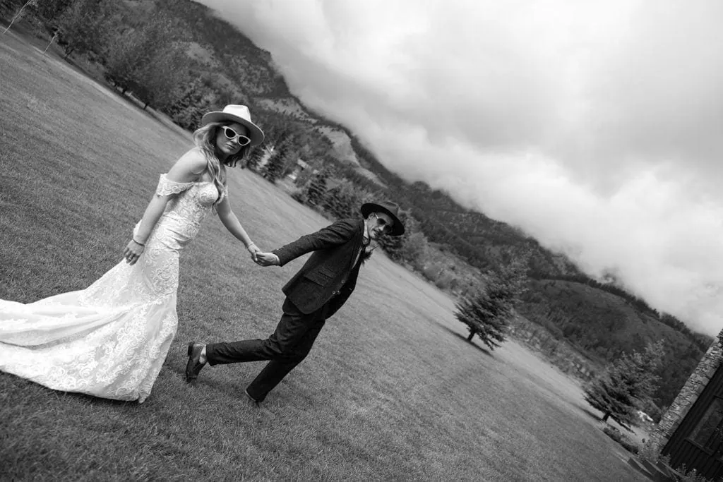 Bride and groom walking outdoors during Wyoming wedding