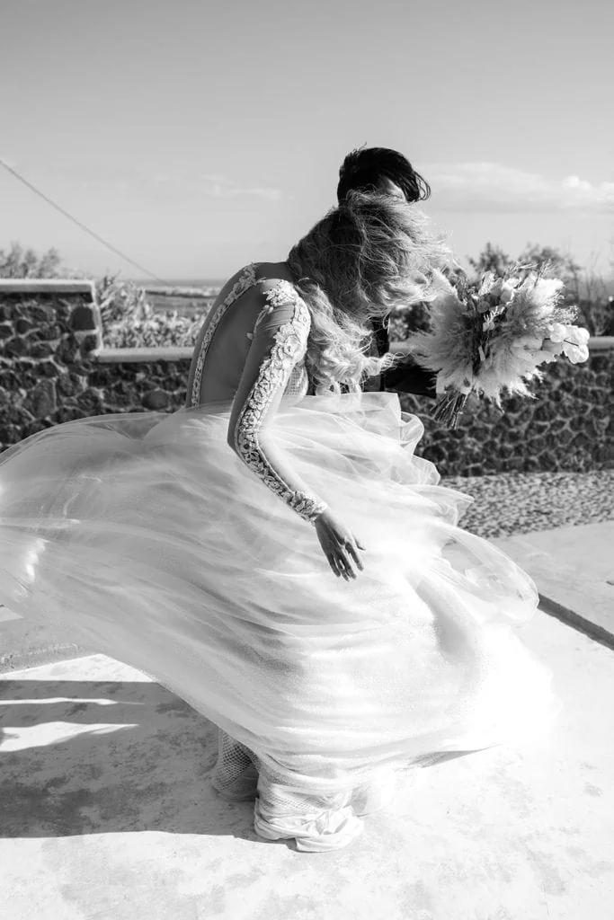Bride's dress is blown in the wind