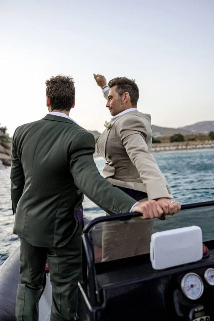Grooms in Riva boat in Greece after wedding ceremony