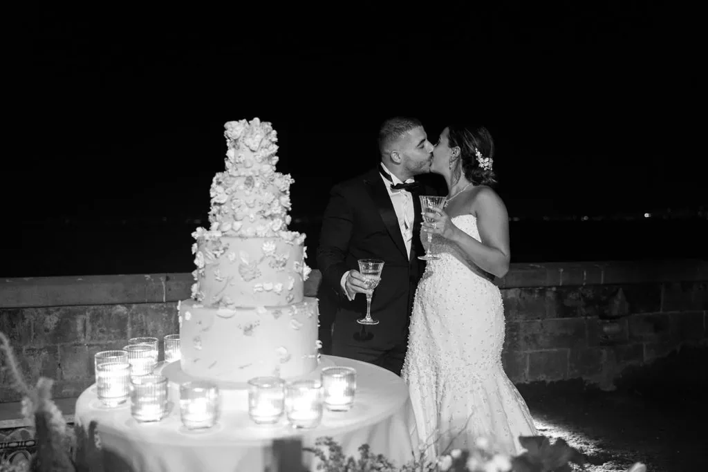 Bride and groom during cake cutting during Villa Astor wedding