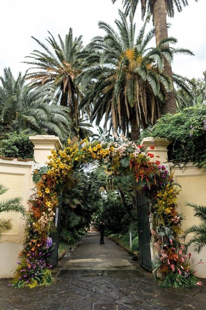 Villa Astor wedding floral arch at entrance of wedding venue