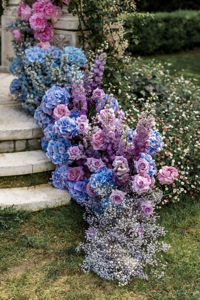 Blue, pink, purple hydrangeas for wedding ceremony flowers