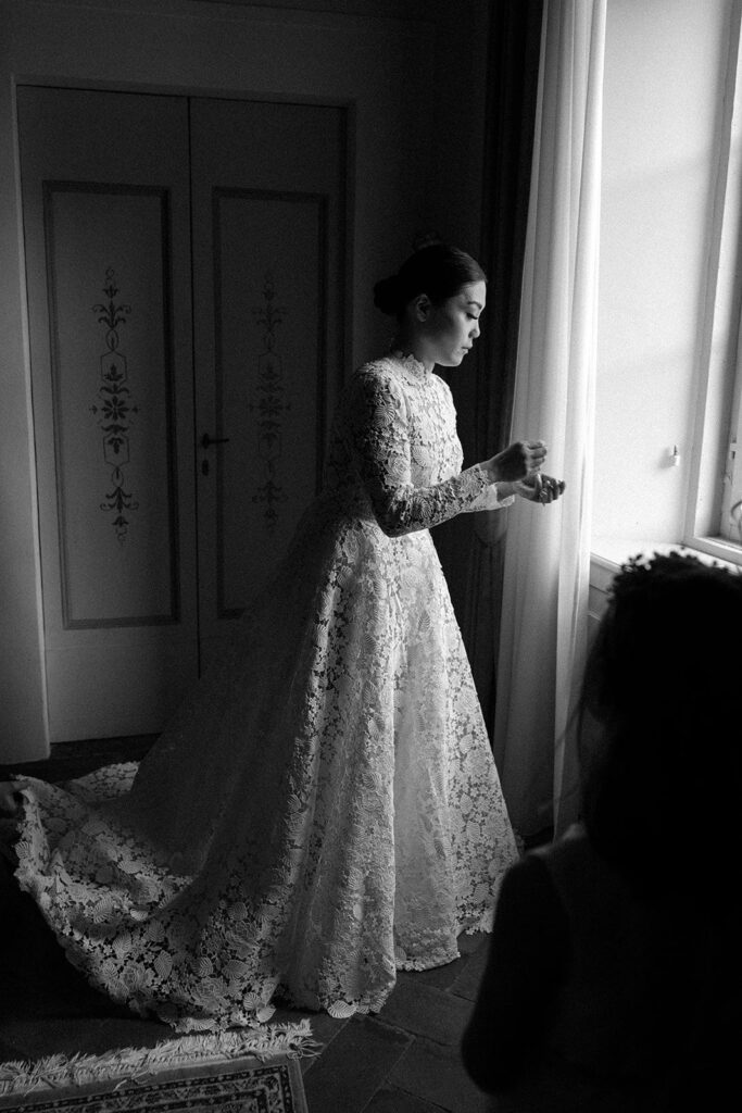 Black and white bridal portrait of bride getting ready