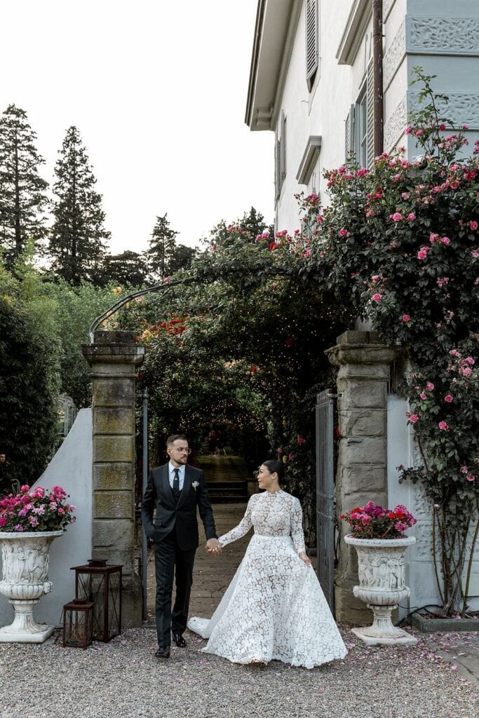 Bride and groom exit Tuscany wedding venue, Villa Guicciardini
