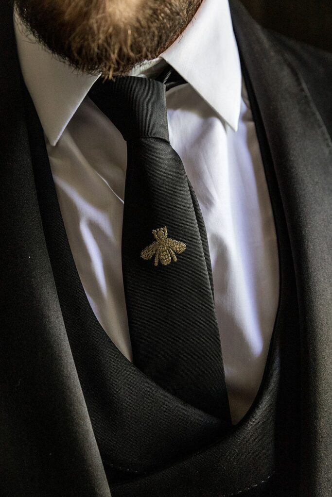 Groom embroidered tie detail