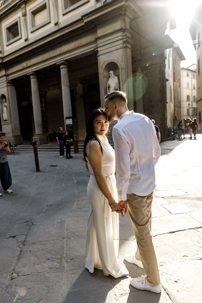 Man kisses woman in Firenze Italy