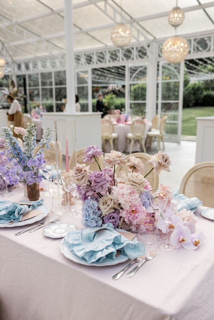 Pastel blue wedding reception table setting