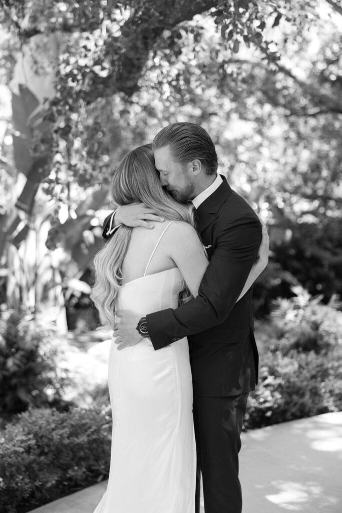 Black and white bride and groom portrait embrace