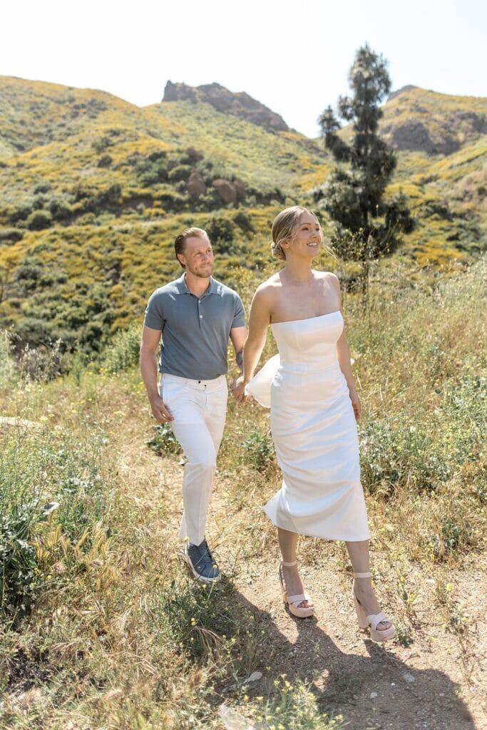 Couple walking hillsides of Malibu