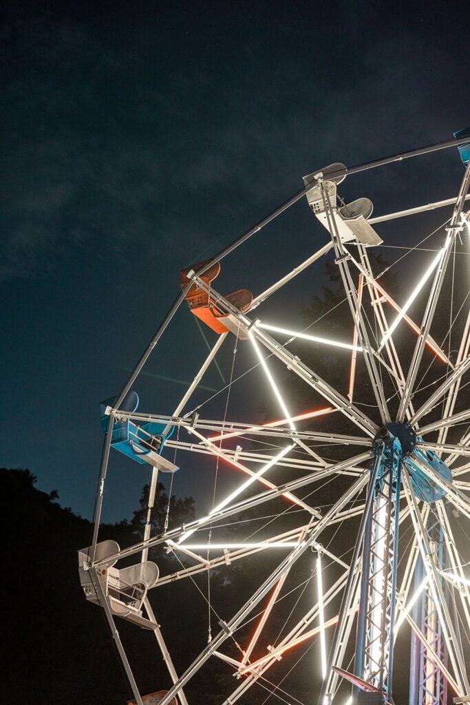 Ferris wheel lit up after dark