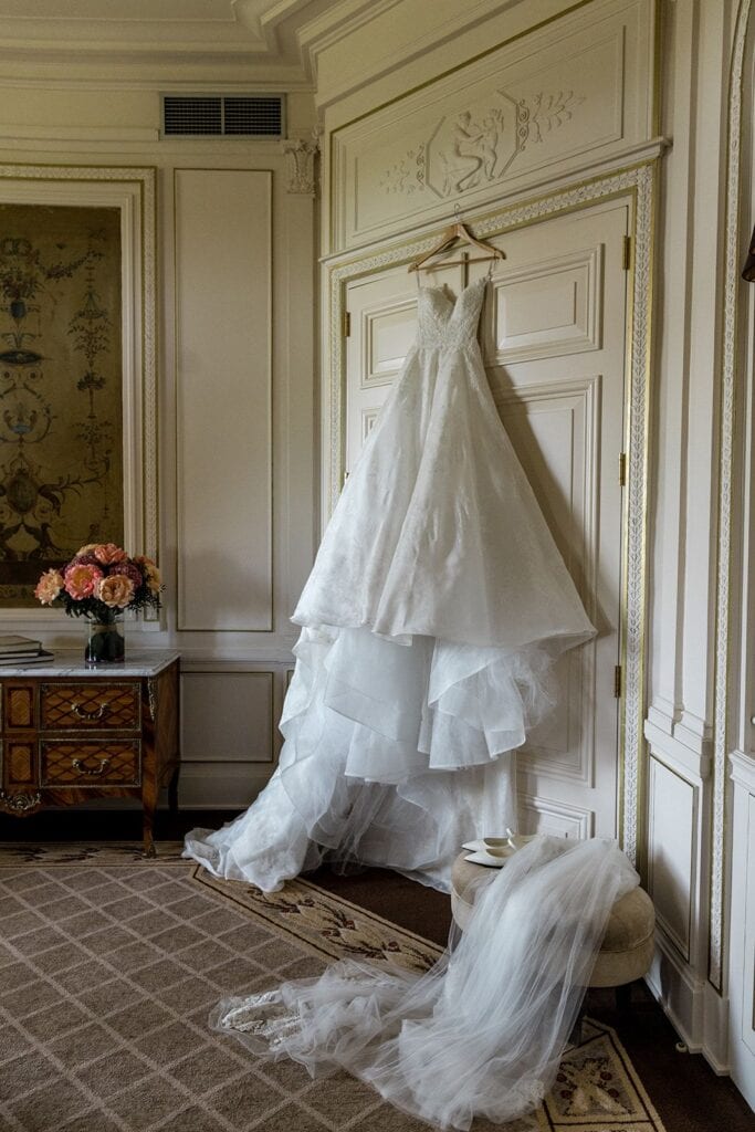 Bride gown hanging in Hotel Mont Royal Chantilly