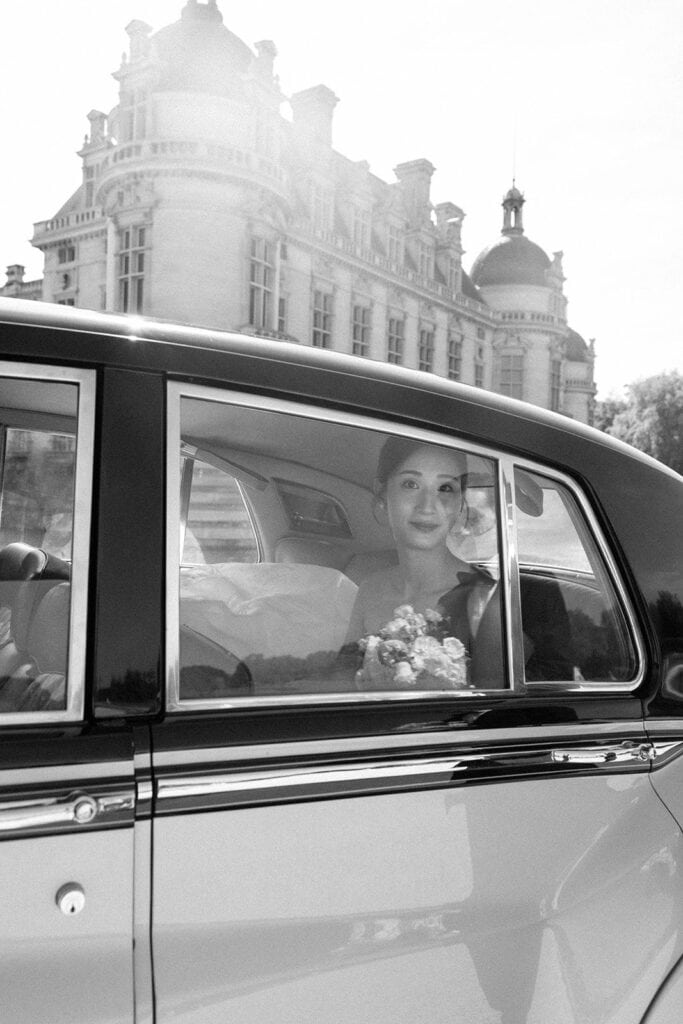 Bride portrait in vintage Rolls Royce