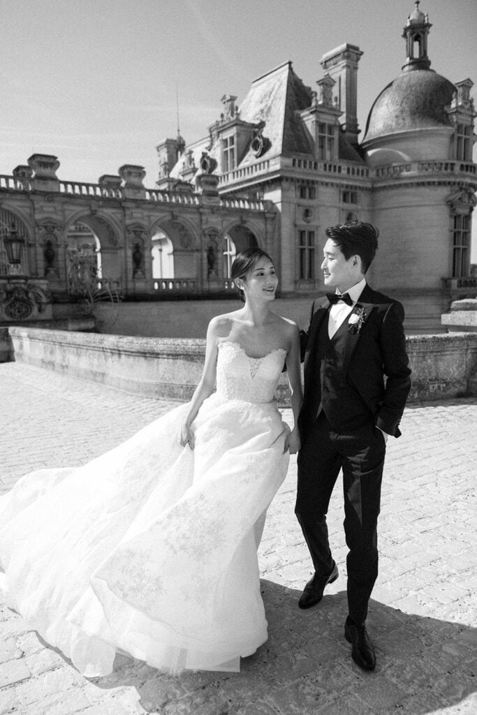 Black and white portrait of bride and groom at Chateau de Chantilly venue
