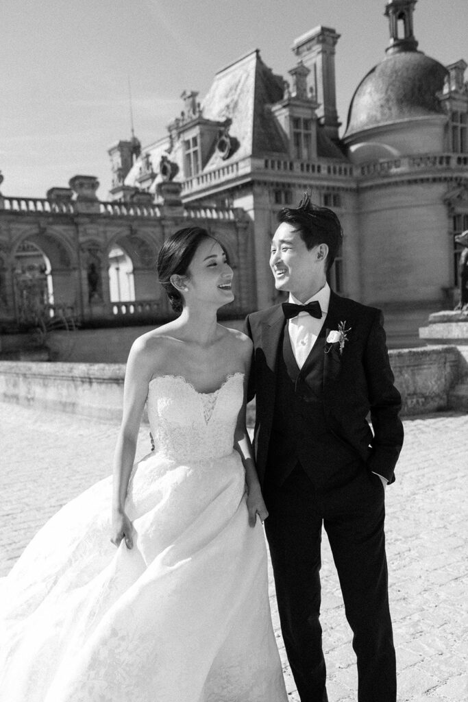 Black and white portrait of bride and groom at French chateau wedding venue
