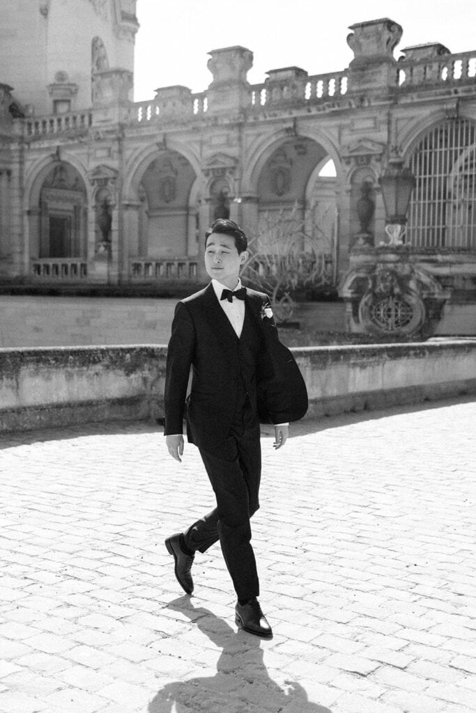 Groom black and white portrait at France chateau wedding venue