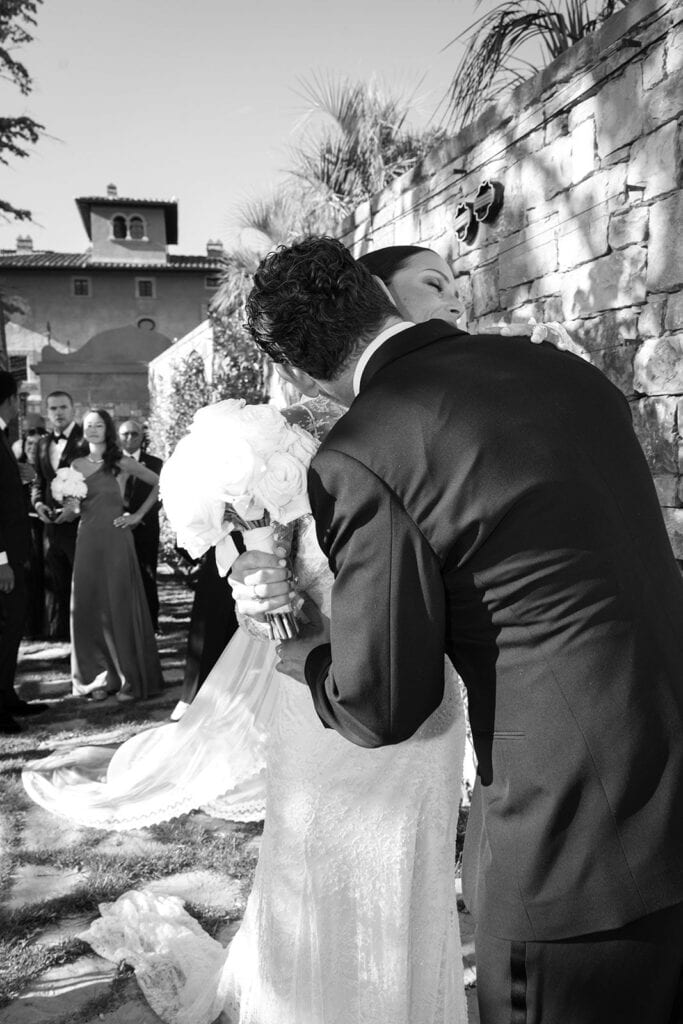 Bride and groom embrace after wedding ceremony