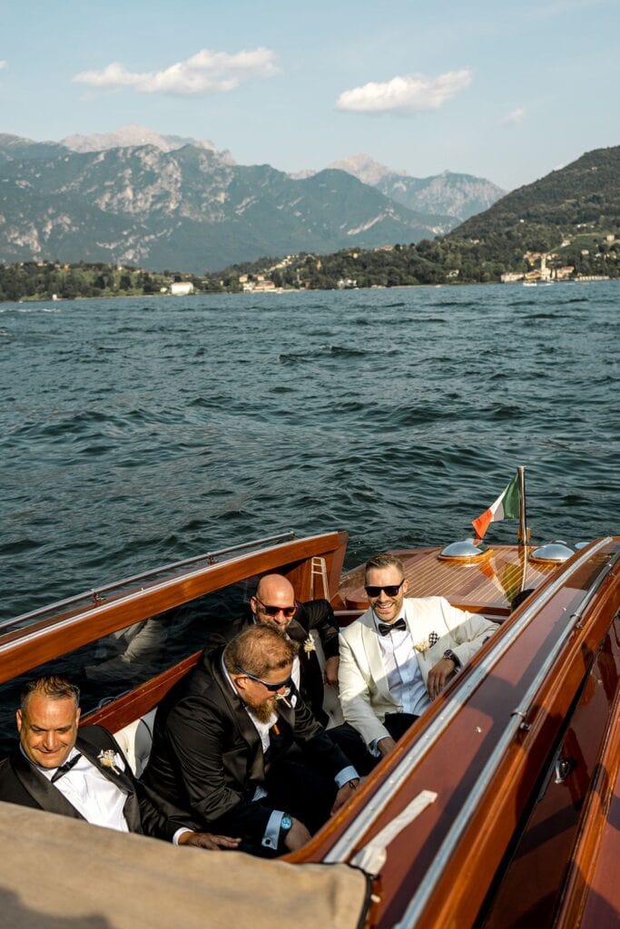Groom and groomsmen arriving to wedding in Riva boat