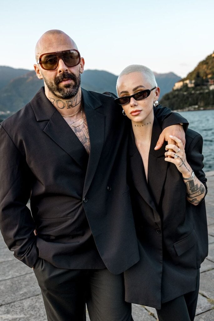 Couple wearing matching black suits