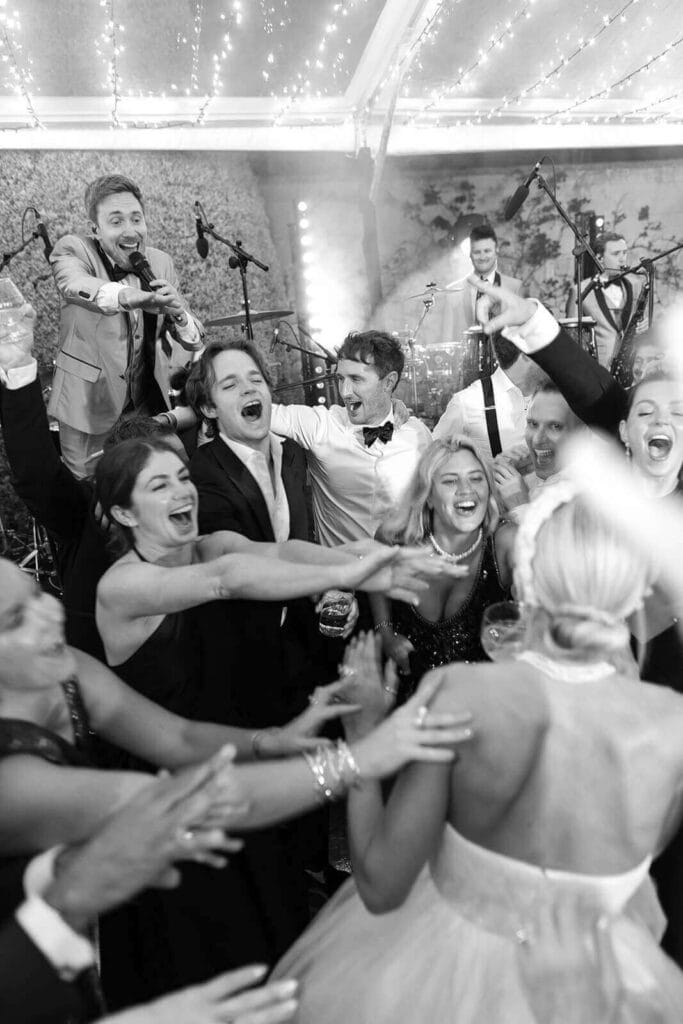 Wedding guests dancing with bride and groom at their wedding in Mallorca, photographed by Lilly Red